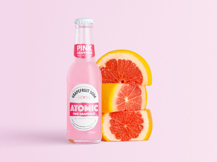 Atomic Pink Grapefruit Soda bottle with grapefruit slices