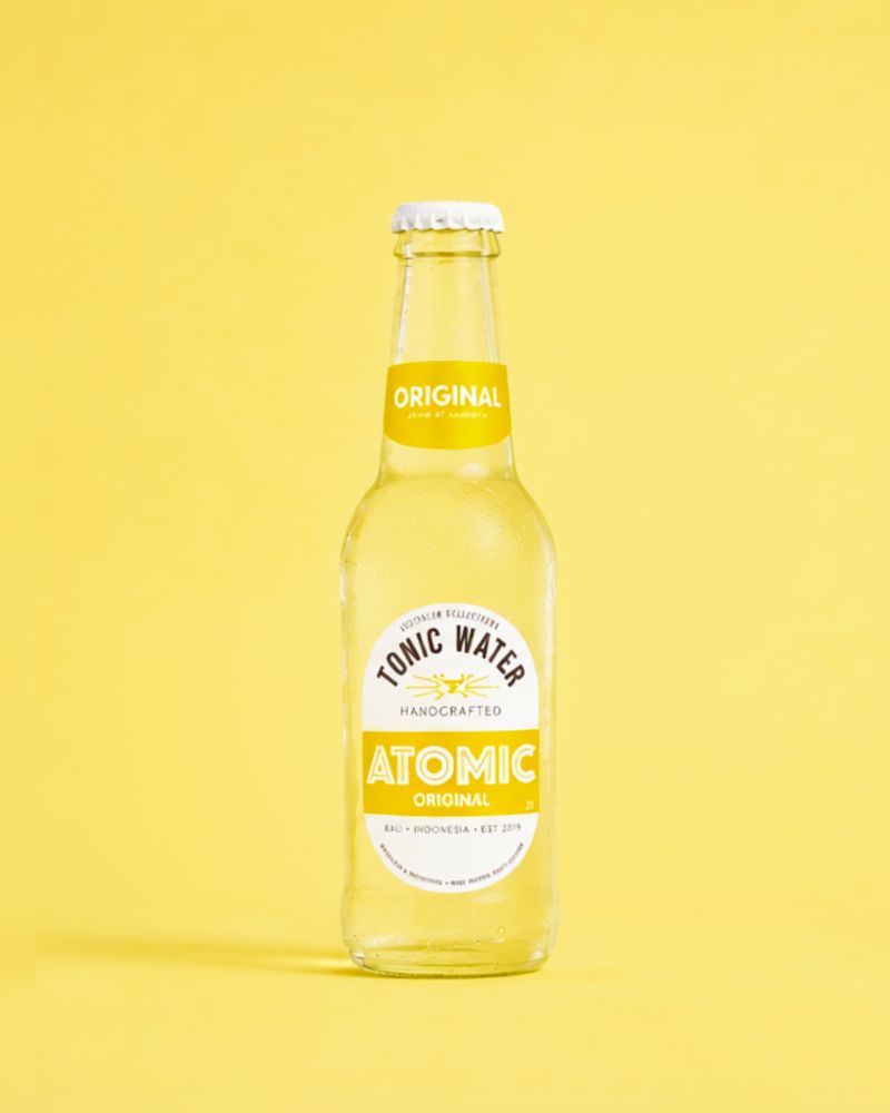 Atomic Original Tonic Water on a yellow background